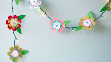 Paper Wedding Crafts: Make a Flower Garland Backdrop by Lia Griffith -  Creativebug
